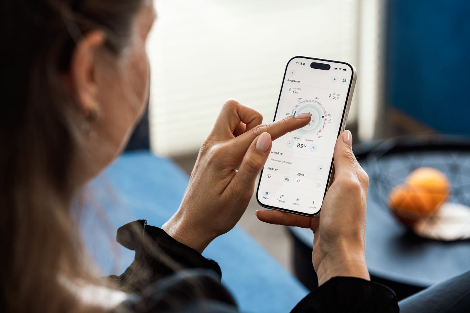 A person using a smart home app on a phone