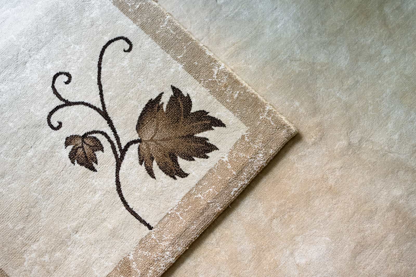 A close-up of textured beige carpet