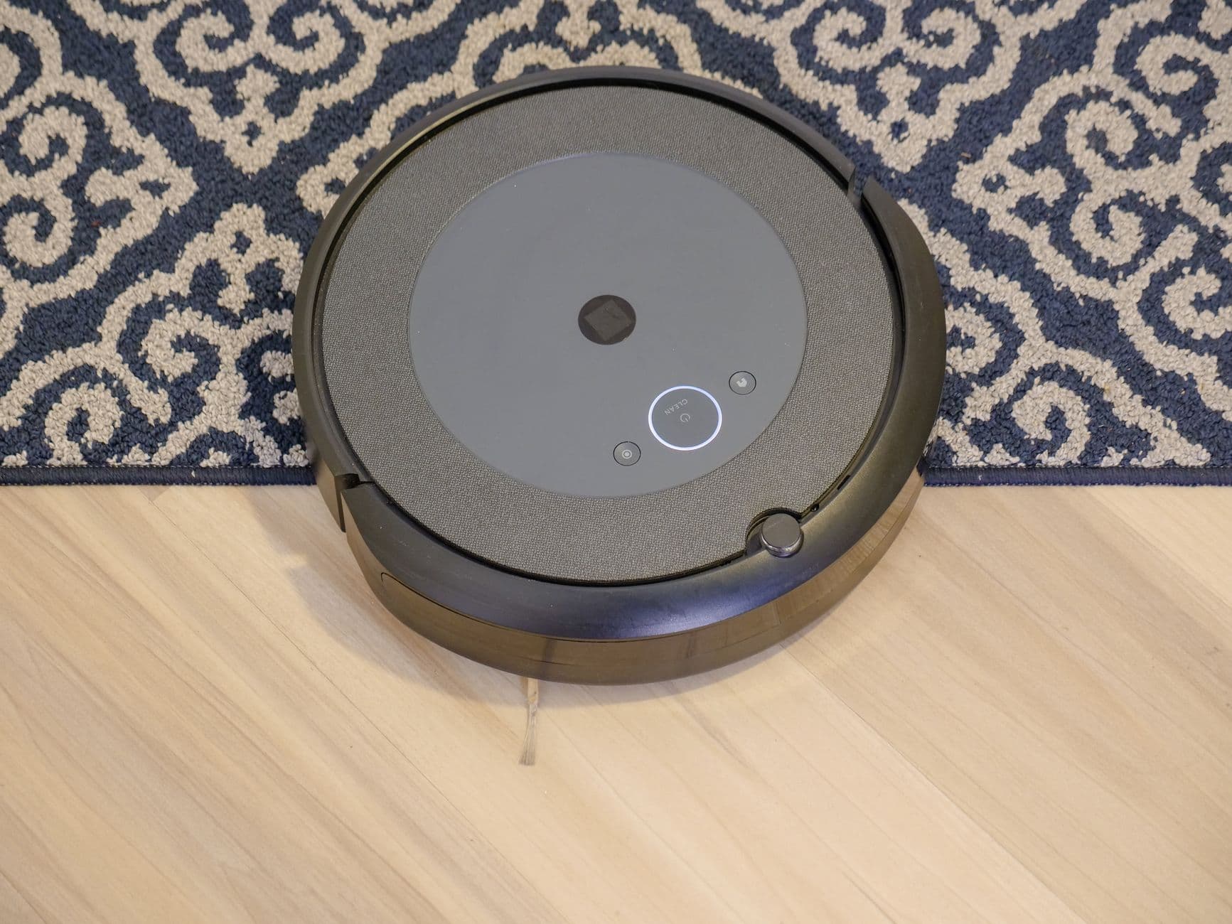 A robot vacuum cleaning a patterned carpet