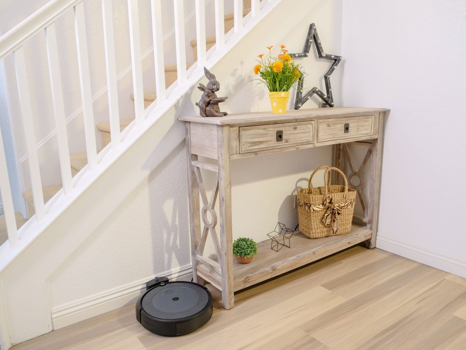 A robot vacuum base station in a hallway