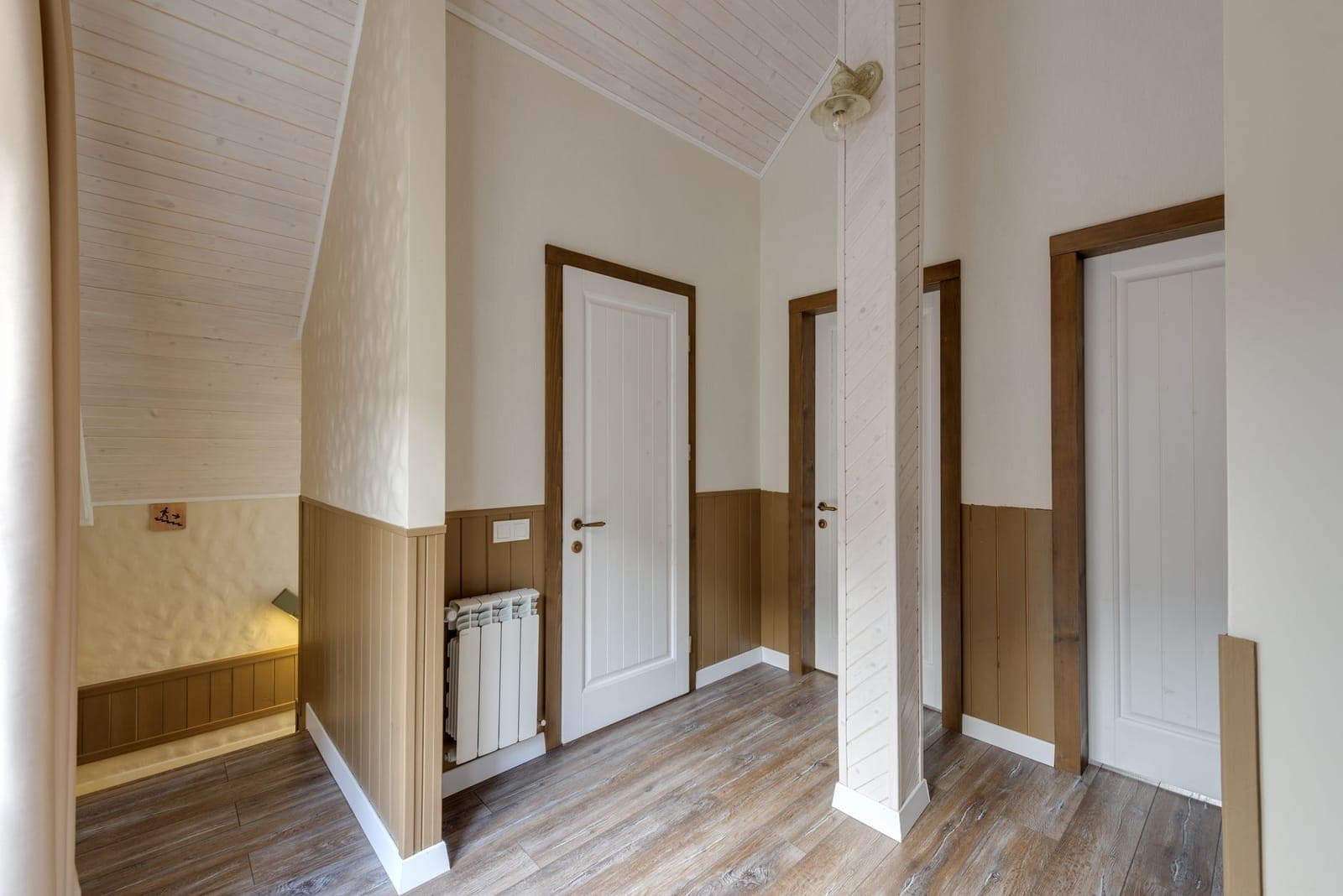 An empty hallway with a wooden floor in a modern home