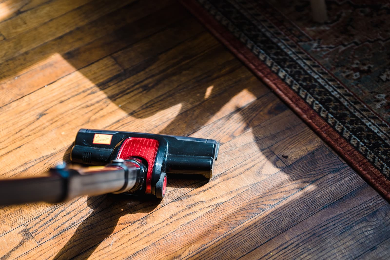 A vacuum cleaner on a floor at home