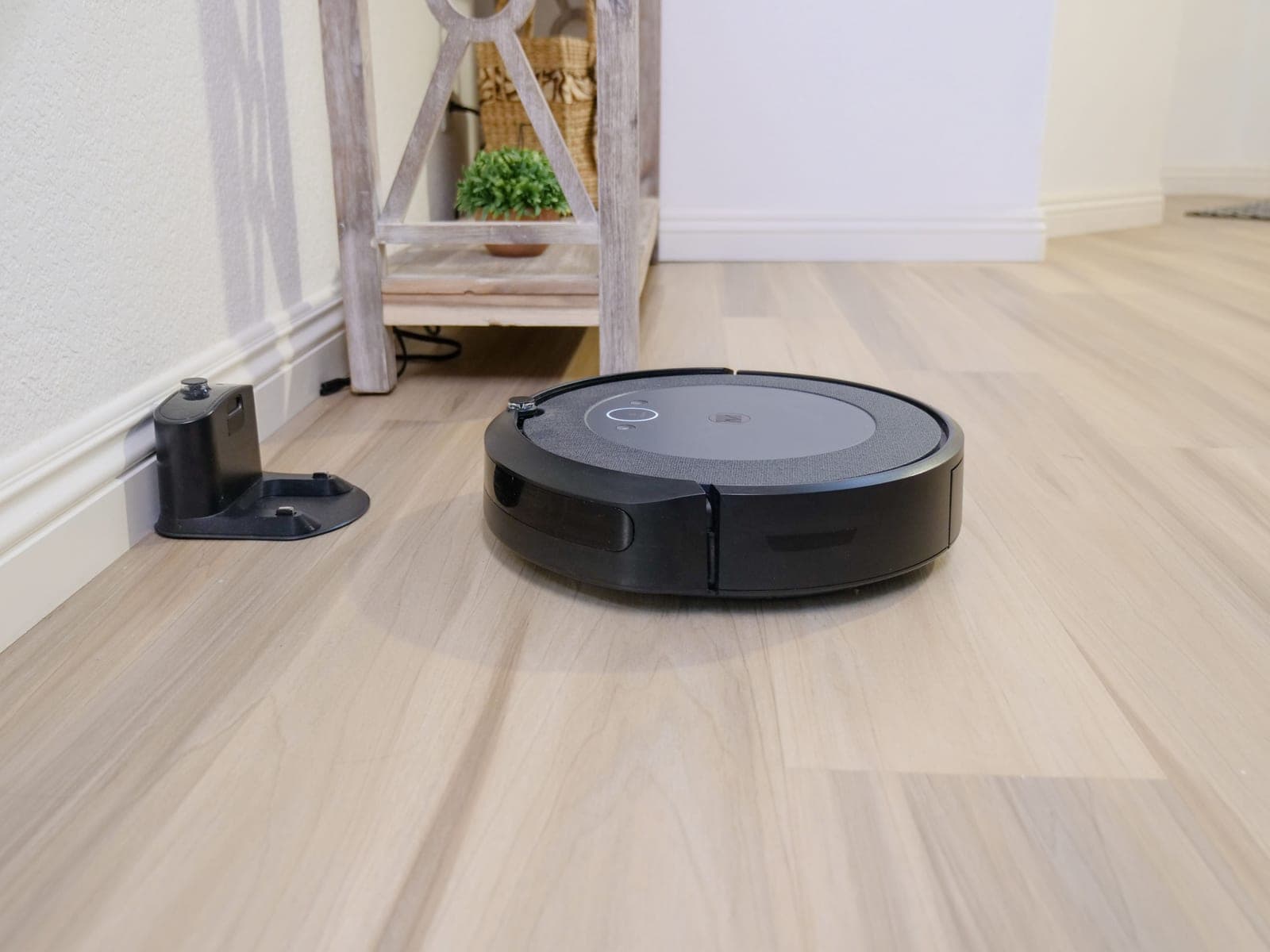 A robot vacuum docked at its charging station in a home
