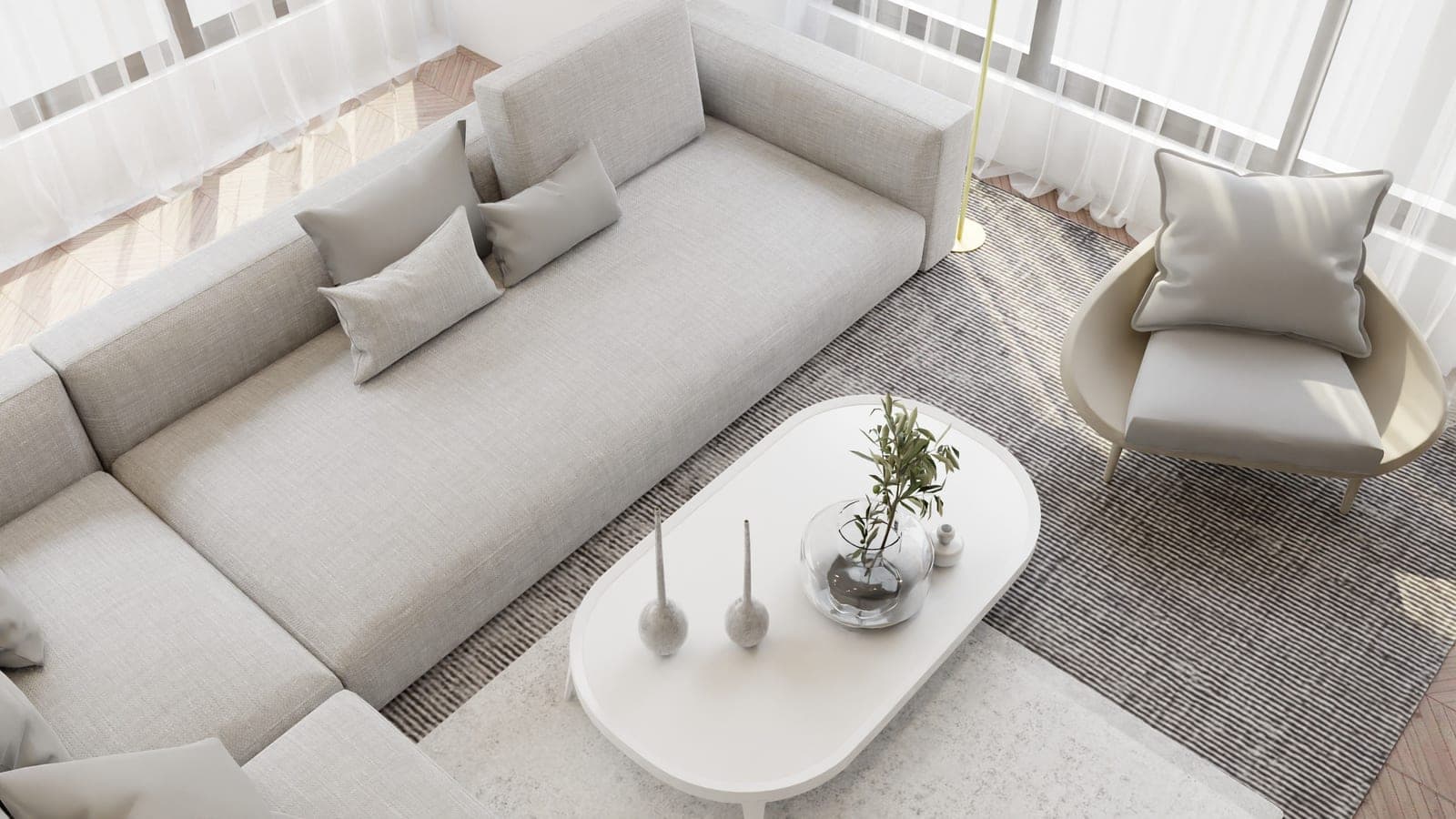 A living room with a rug, sofa and wooden floor in daylight